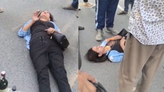 नोएडा: नशे में धुत लड़की का ड्रामा, बीच सड़क पर लेट कर किया हंगामा; Video